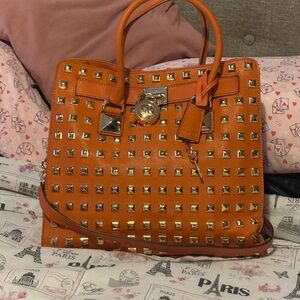 MK orange leather studded bag